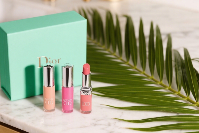 Dior Lip Glow Trio in summer shades on marble with palm leaf, luxury lip balm gift for her