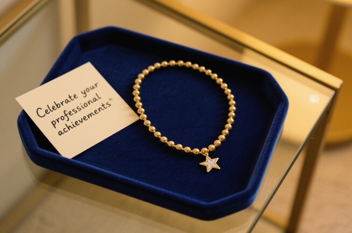 Minimalist personalized jewelry for women celebrating career achievements.