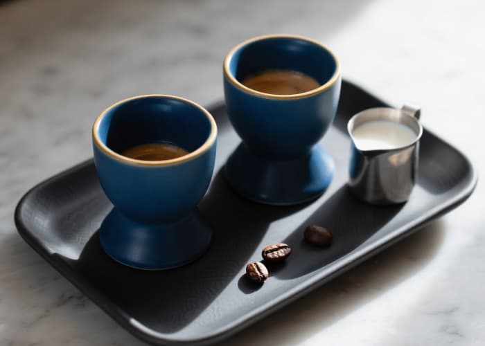Set of two stylish weighted espresso cups and saucers for a luxurious coffee moment